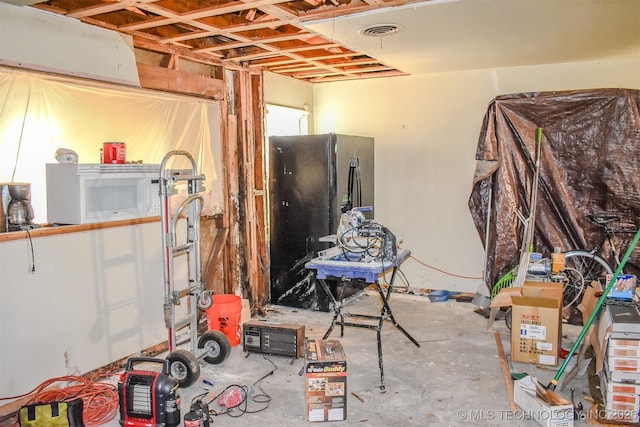 1108 E E Blf, Hugo, OK 74743 - below grade area featuring freestanding refrigerator