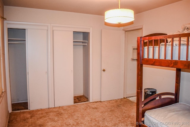 1108 E E Blf, Hugo, OK 74743 - bedroom featuring carpet floors and two closets