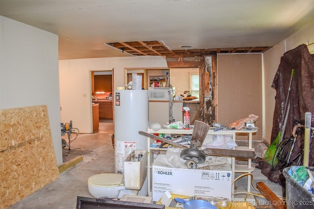 1108 E E Blf, Hugo, OK 74743 - miscellaneous room with water heater and concrete flooring