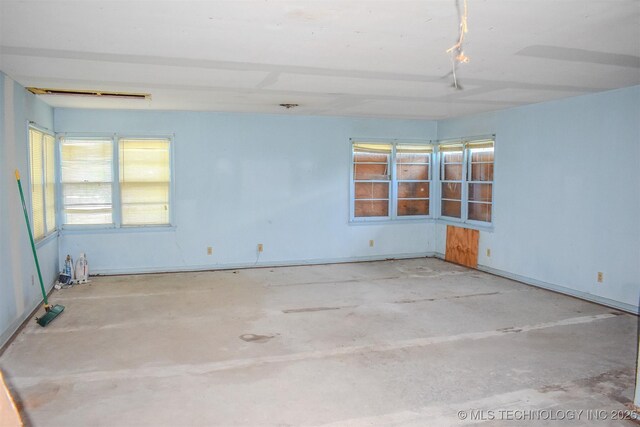 1108 E E Blf, Hugo, OK 74743 - empty room with unfinished concrete floors