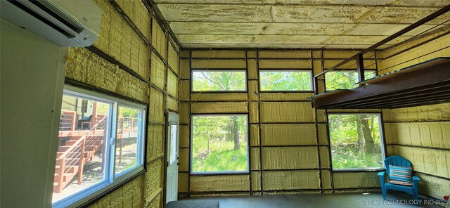 140 Last Resort Rd, Stigler, OK 74462 - unfurnished sunroom featuring a wall mounted AC