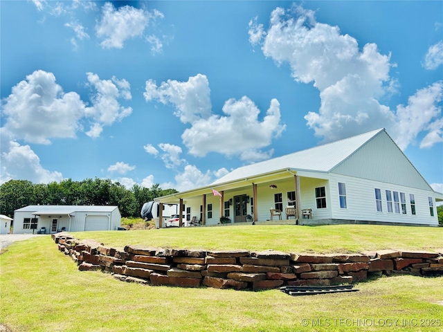 157 Canna Ln, Mcalester, OK 74501 - rear view of house with a yard, a garage, and an outdoor structure