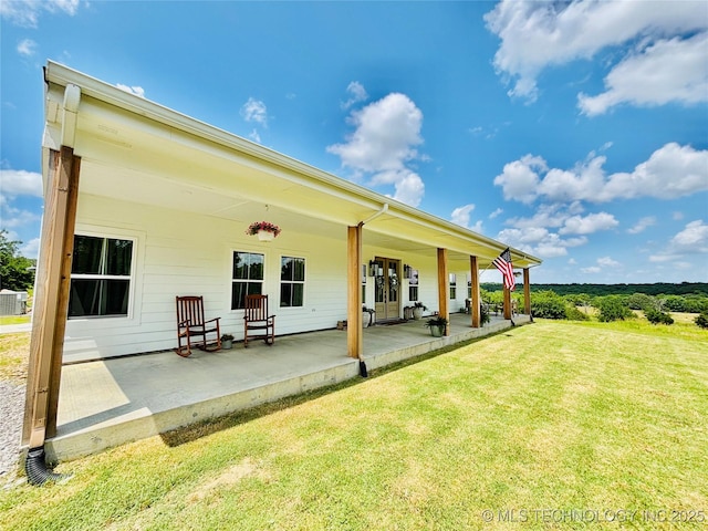 157 Canna Ln, Mcalester, OK 74501 - back of house with a lawn and a patio area