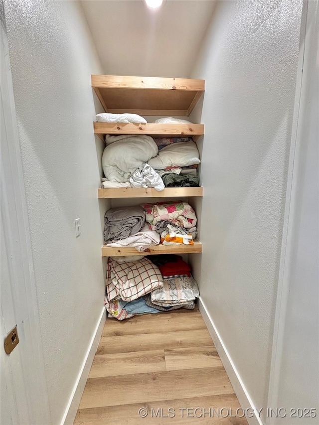 157 Canna Ln, Mcalester, OK 74501 - walk in closet featuring wood finished floors