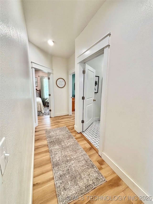 157 Canna Ln, Mcalester, OK 74501 - hallway with light wood finished floors and baseboards