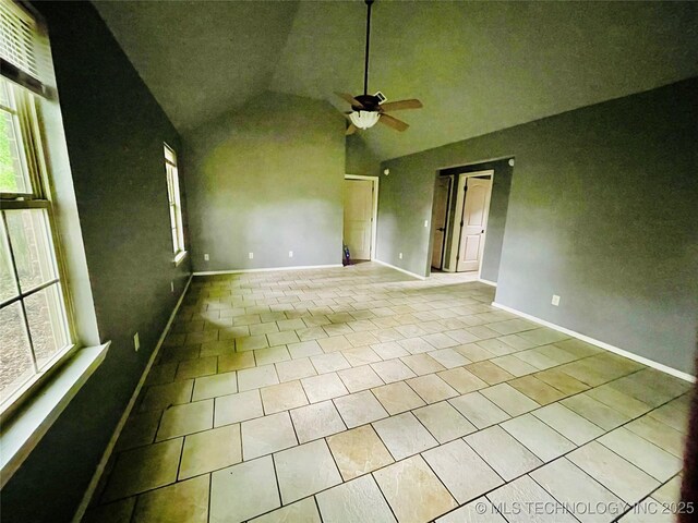 605 N Maple, Sallisaw, OK 74955 - empty room featuring a ceiling fan, tile patterned flooring, baseboards, and high vaulted ceiling
