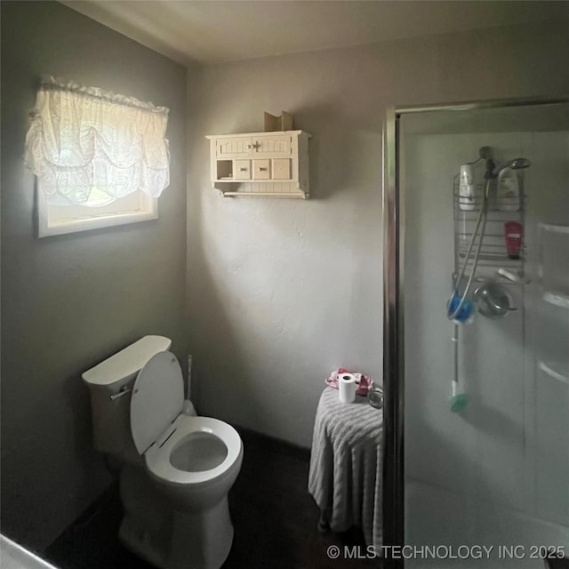 1003 E 4th St, Cushing, OK 74023 - full bath with a stall shower and toilet