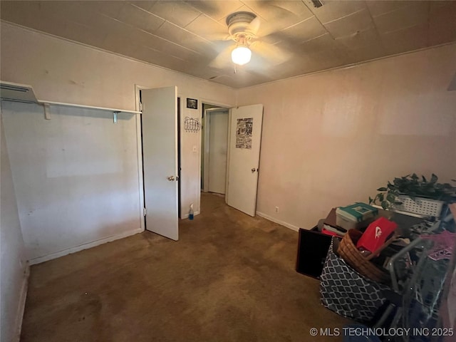 1003 E 4th St, Cushing, OK 74023 - unfurnished bedroom with carpet, baseboards, and ceiling fan