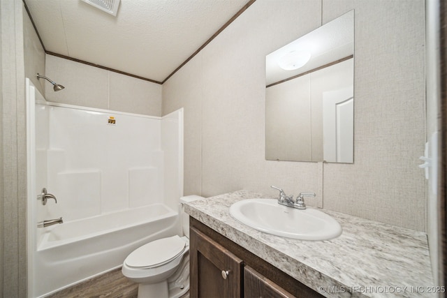 348939 E 750th Rd, Cushing, OK 74023 - full bathroom featuring vanity, bathing tub / shower combination, toilet, wood finished floors, and a textured ceiling