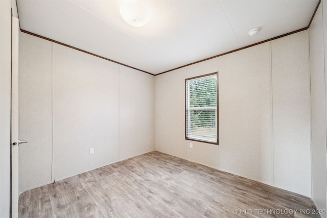 348939 E 750th Rd, Cushing, OK 74023 - spare room featuring light wood-style flooring, a smoke detector, and ornamental molding