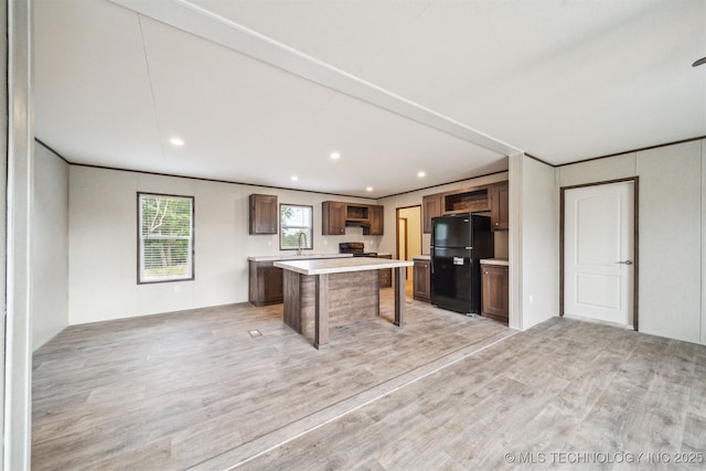 348939 E 750th Rd, Cushing, OK 74023 - kitchen with black appliances, light countertops, a kitchen island, light wood finished floors, and recessed lighting
