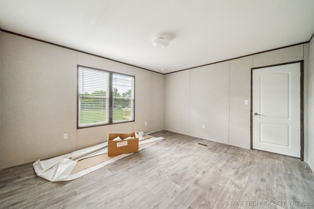 348939 E 750th Rd, Cushing, OK 74023 - unfurnished room featuring wood finished floors and crown molding