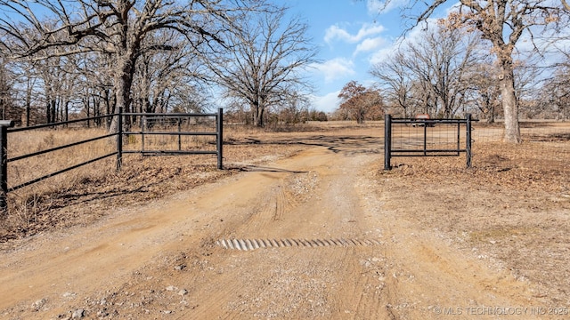 6263 Sunshine Rd, Davis, OK 73030 - view of dirt / gravel road with a gate and a view of countryside
