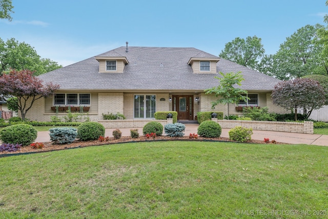 1209 Sherwood Ln, Broken Arrow, OK 74011 - view of front of home featuring a front yard, brick siding, and a shingled roof