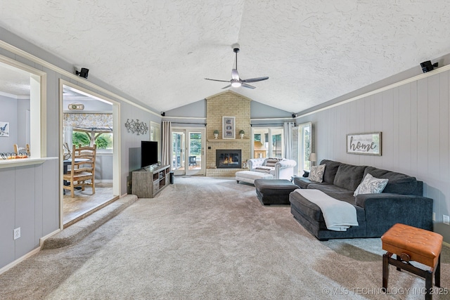 1209 Sherwood Ln, Broken Arrow, OK 74011 - carpeted living room featuring a ceiling fan, a brick fireplace, vaulted ceiling, a textured ceiling, and crown molding