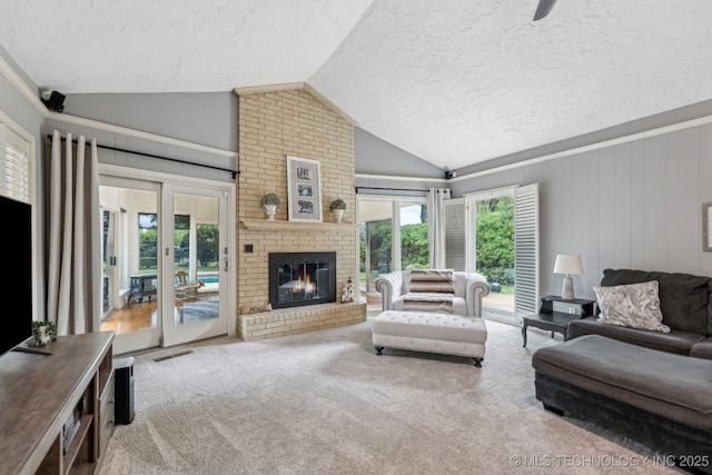 1209 Sherwood Ln, Broken Arrow, OK 74011 - living room featuring a textured ceiling, vaulted ceiling, carpet floors, and a fireplace
