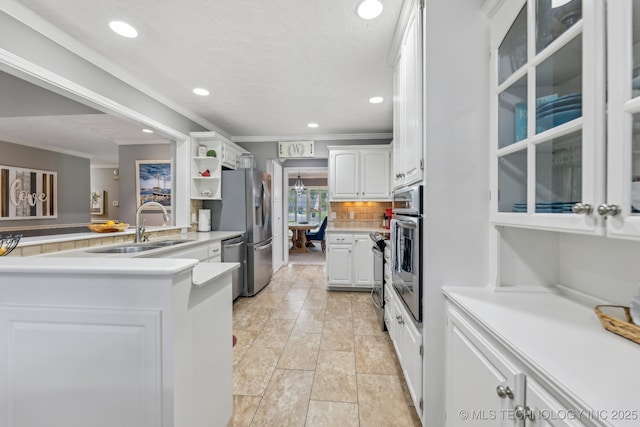 1209 Sherwood Ln, Broken Arrow, OK 74011 - kitchen with a sink, crown molding, white cabinetry, appliances with stainless steel finishes, and recessed lighting