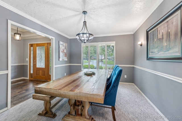 1209 Sherwood Ln, Broken Arrow, OK 74011 - dining area with baseboards, a textured ceiling, ornamental molding, and a chandelier