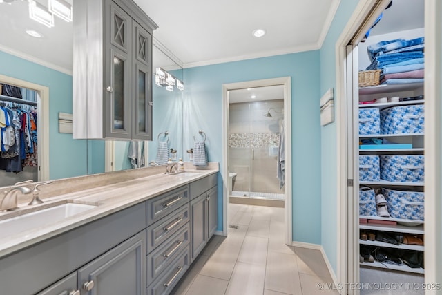 1209 Sherwood Ln, Broken Arrow, OK 74011 - full bath featuring double vanity, a shower stall, a spacious closet, tile patterned floors, and crown molding