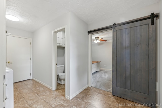 1209 Sherwood Ln, Broken Arrow, OK 74011 - bathroom featuring toilet, a textured ceiling, tile patterned floors, and baseboards