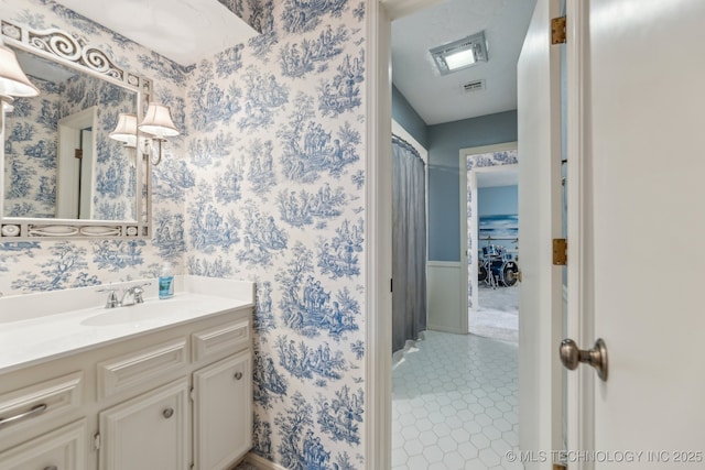 1209 Sherwood Ln, Broken Arrow, OK 74011 - bathroom with vanity and wallpapered walls