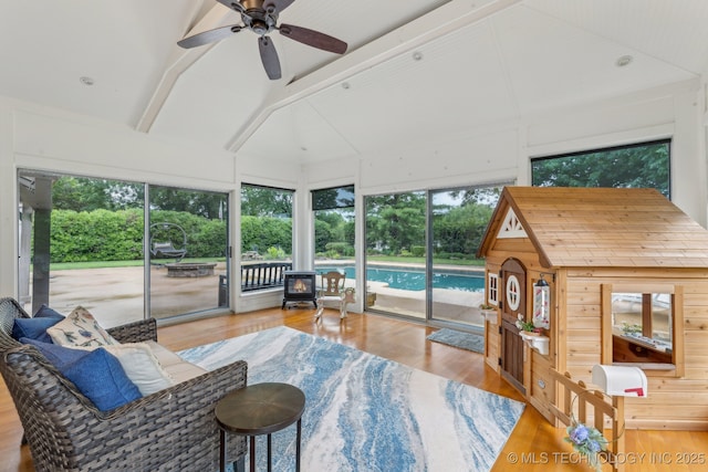 1209 Sherwood Ln, Broken Arrow, OK 74011 - living room with a ceiling fan, wood finished floors, and a wood stove