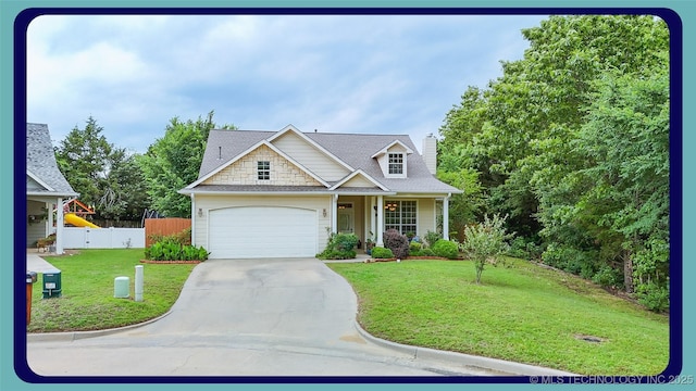 1318 Emily Ln, Ada, OK 74820 - view of front facade with driveway, an attached garage, and a porch