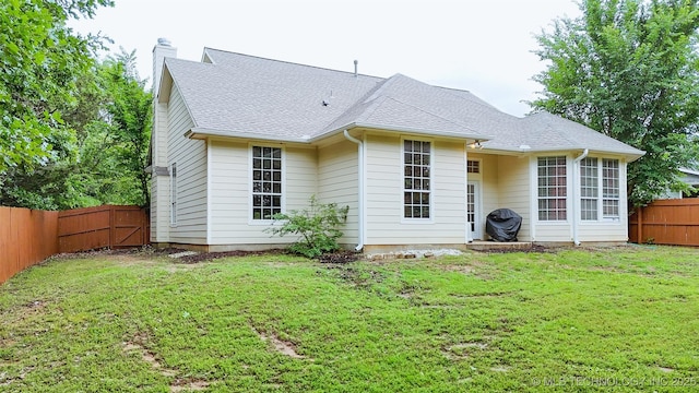 1318 Emily Ln, Ada, OK 74820 - rear view of property with a chimney and roof with shingles