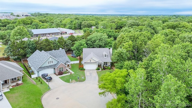 1318 Emily Ln, Ada, OK 74820 - aerial view of residential area featuring a heavily wooded area