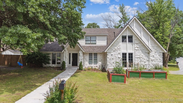 11033 E 66th St, Tulsa, OK 74133 - tudor house featuring stone siding, a vegetable garden, and roof with shingles