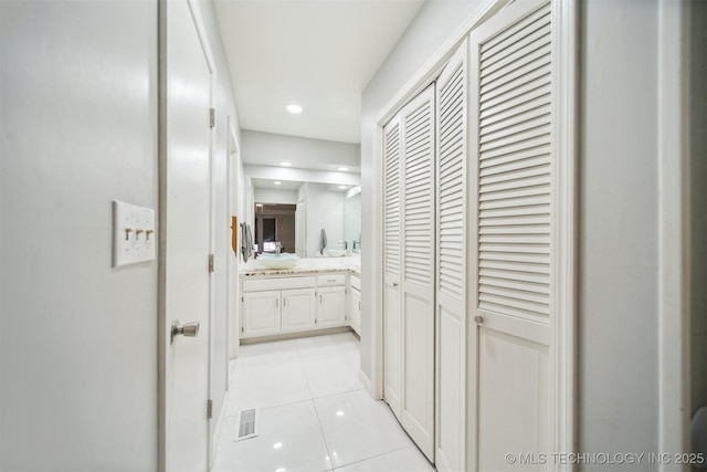 11033 E 66th St, Tulsa, OK 74133 - hallway featuring light tile patterned floors and recessed lighting