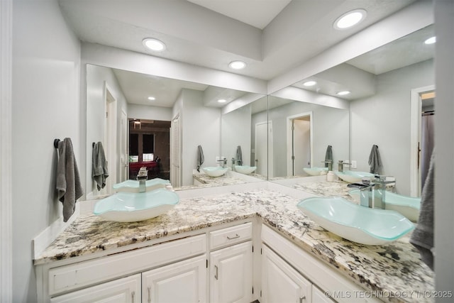 11033 E 66th St, Tulsa, OK 74133 - full bathroom featuring double vanity and recessed lighting