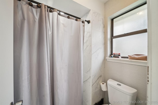 11033 E 66th St, Tulsa, OK 74133 - bathroom with toilet and curtained shower