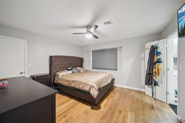 11033 E 66th St, Tulsa, OK 74133 - bedroom with light wood-style floors, ceiling fan, and baseboards