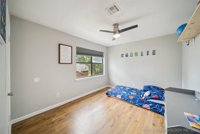 11033 E 66th St, Tulsa, OK 74133 - bedroom with wood finished floors, baseboards, and a ceiling fan