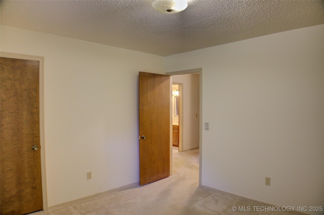 4004 S Hickory Ave, Broken Arrow, OK 74011 - unfurnished room with light colored carpet and a textured ceiling