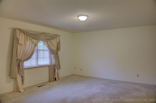 4004 S Hickory Ave, Broken Arrow, OK 74011 - unfurnished room with light colored carpet and a textured ceiling