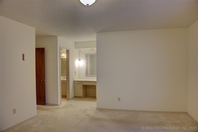4004 S Hickory Ave, Broken Arrow, OK 74011 - spare room featuring light colored carpet, a textured ceiling, and baseboards