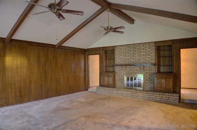 4004 S Hickory Ave, Broken Arrow, OK 74011 - unfurnished living room featuring ceiling fan, carpet floors, wood walls, and a brick fireplace