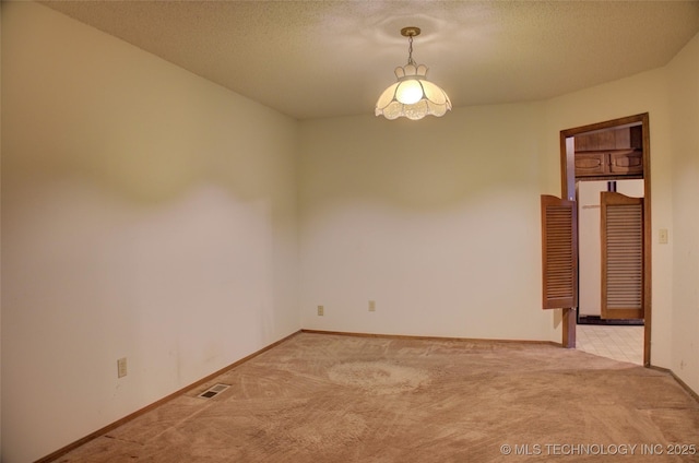 4004 S Hickory Ave, Broken Arrow, OK 74011 - spare room with carpet flooring, baseboards, and a textured ceiling