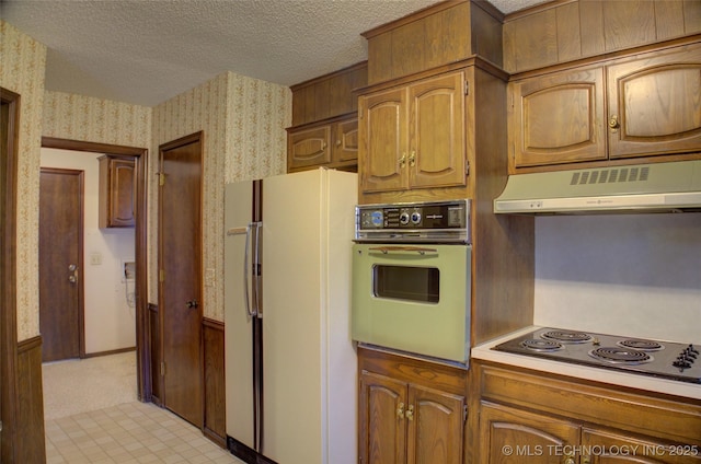 4004 S Hickory Ave, Broken Arrow, OK 74011 - kitchen with oven, freestanding refrigerator, exhaust hood, electric stovetop, and wallpapered walls