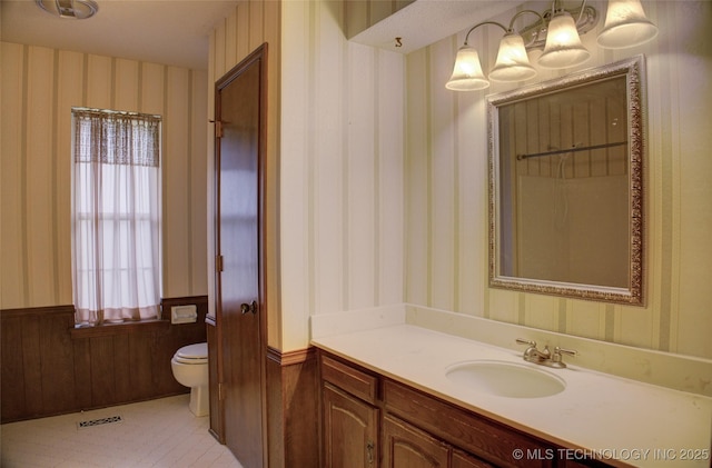 4004 S Hickory Ave, Broken Arrow, OK 74011 - bathroom with wallpapered walls, toilet, vanity, and wainscoting