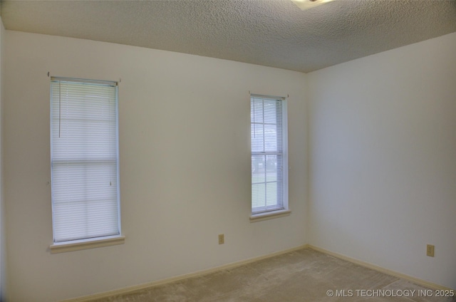 4004 S Hickory Ave, Broken Arrow, OK 74011 - unfurnished room featuring light colored carpet, a textured ceiling, and baseboards