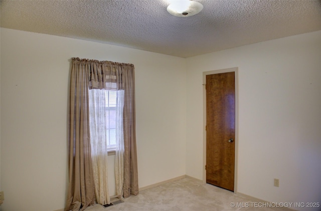 4004 S Hickory Ave, Broken Arrow, OK 74011 - empty room with light colored carpet and a textured ceiling