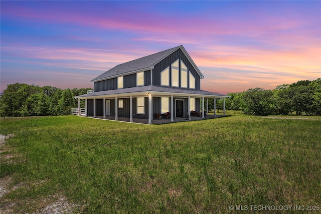 5122 State Road 70e E, Durant, OK 74701 - back of property at dusk featuring a yard and roof with shingles
