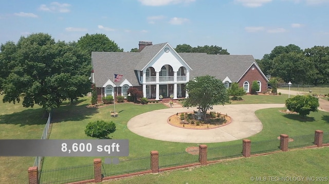 66235 S 320th Rd, Chouteau, OK 74337 - view of front of property with a balcony, a chimney, and curved driveway