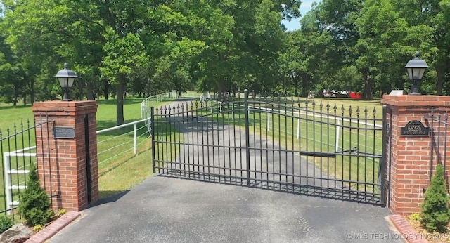 66235 S 320th Rd, Chouteau, OK 74337 - gate featuring view of wooded area