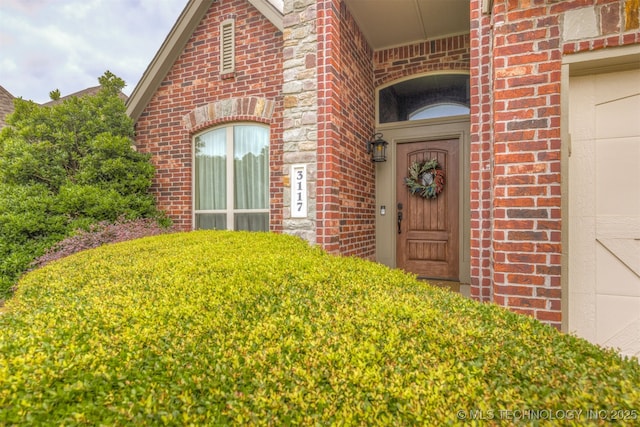 3117 S Hemlock Ct, Broken Arrow, OK 74012 - doorway to property featuring brick siding
