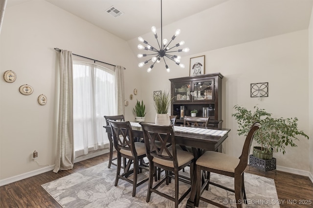 3117 S Hemlock Ct, Broken Arrow, OK 74012 - dining space with vaulted ceiling, a chandelier, baseboards, and wood finished floors