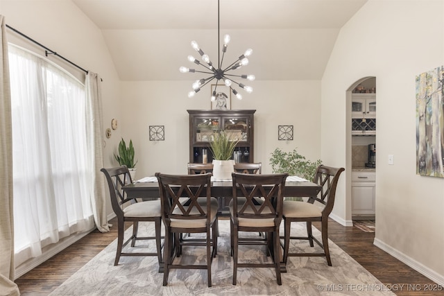 3117 S Hemlock Ct, Broken Arrow, OK 74012 - dining room with lofted ceiling, a chandelier, dark wood-style floors, and baseboards